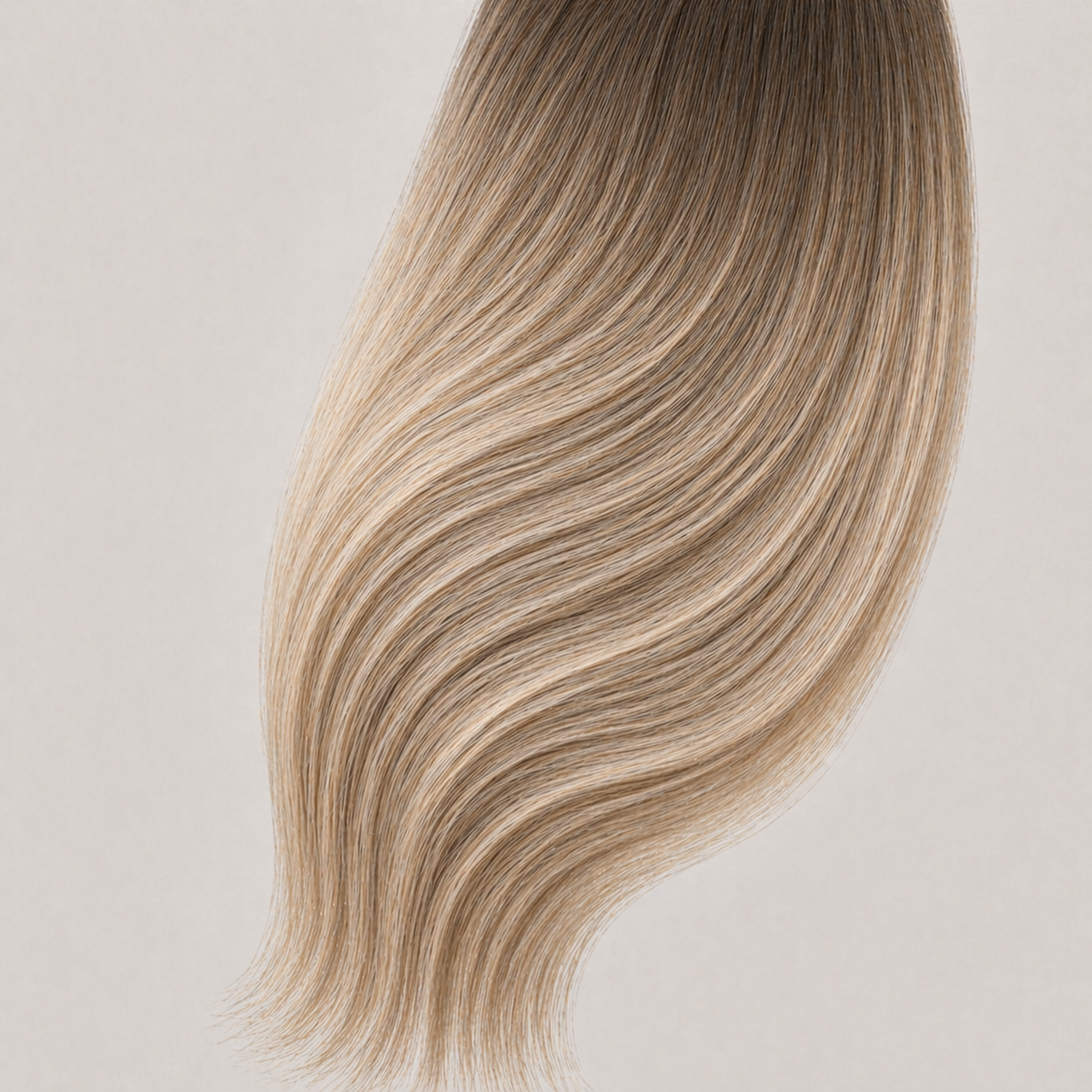 Stessia butterfly weft hair extensions in shade #10/24 Balayage, laid flat