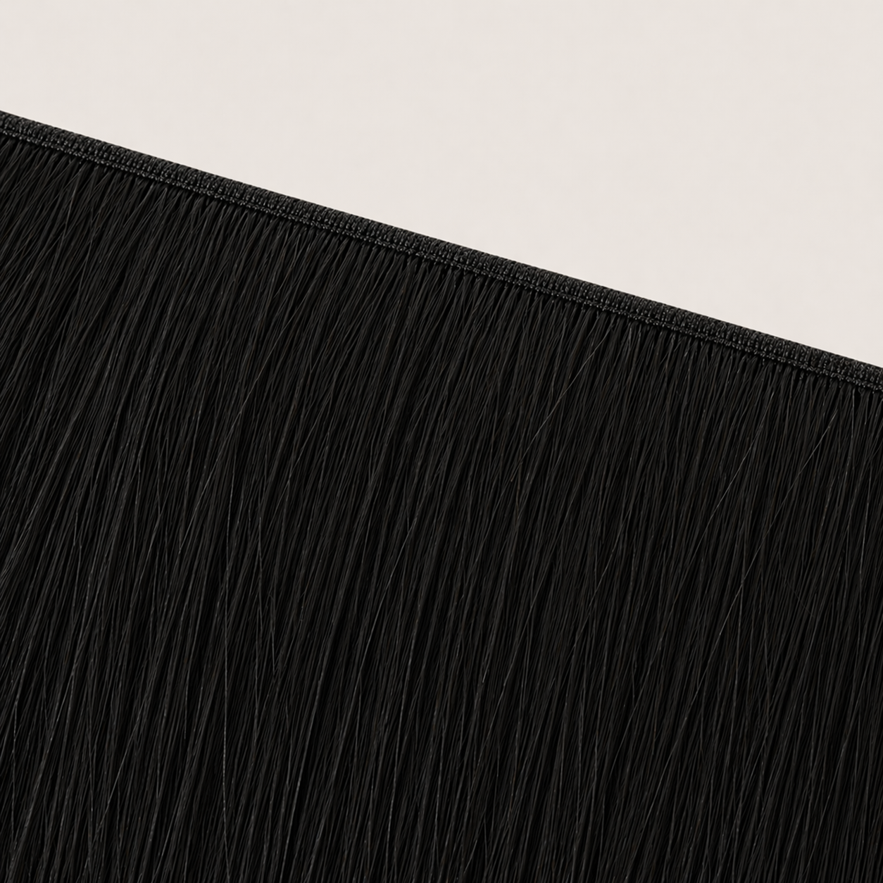 Flat butterfly weft seam of Stessia hair extensions in shade #1B Brown Black
