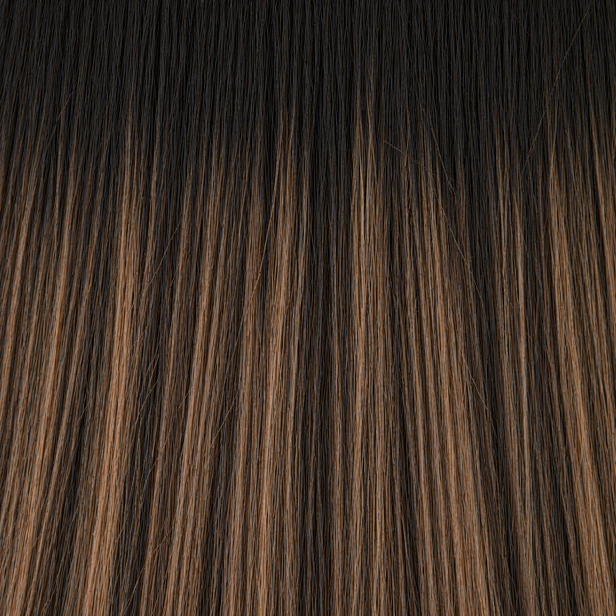 Close-up of the Remy human hair texture in shade #1B/6 Balayage