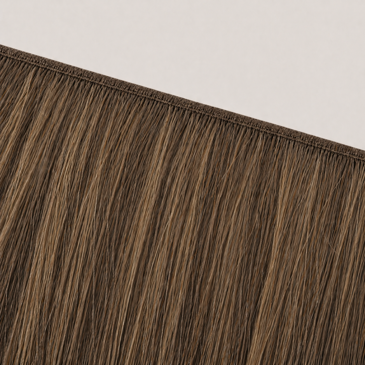 Flat butterfly weft seam of Stessia hair extensions in shade #4/6 Highlights