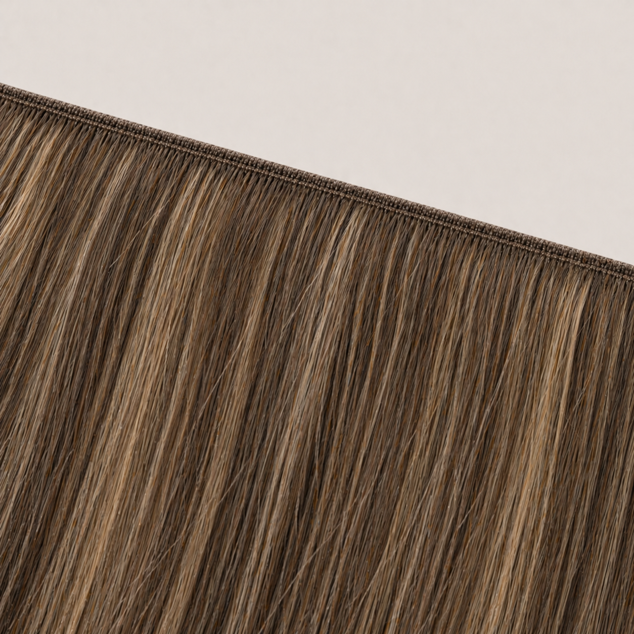 Flat butterfly weft seam of Stessia hair extensions in shade #4/8/18 Highlights