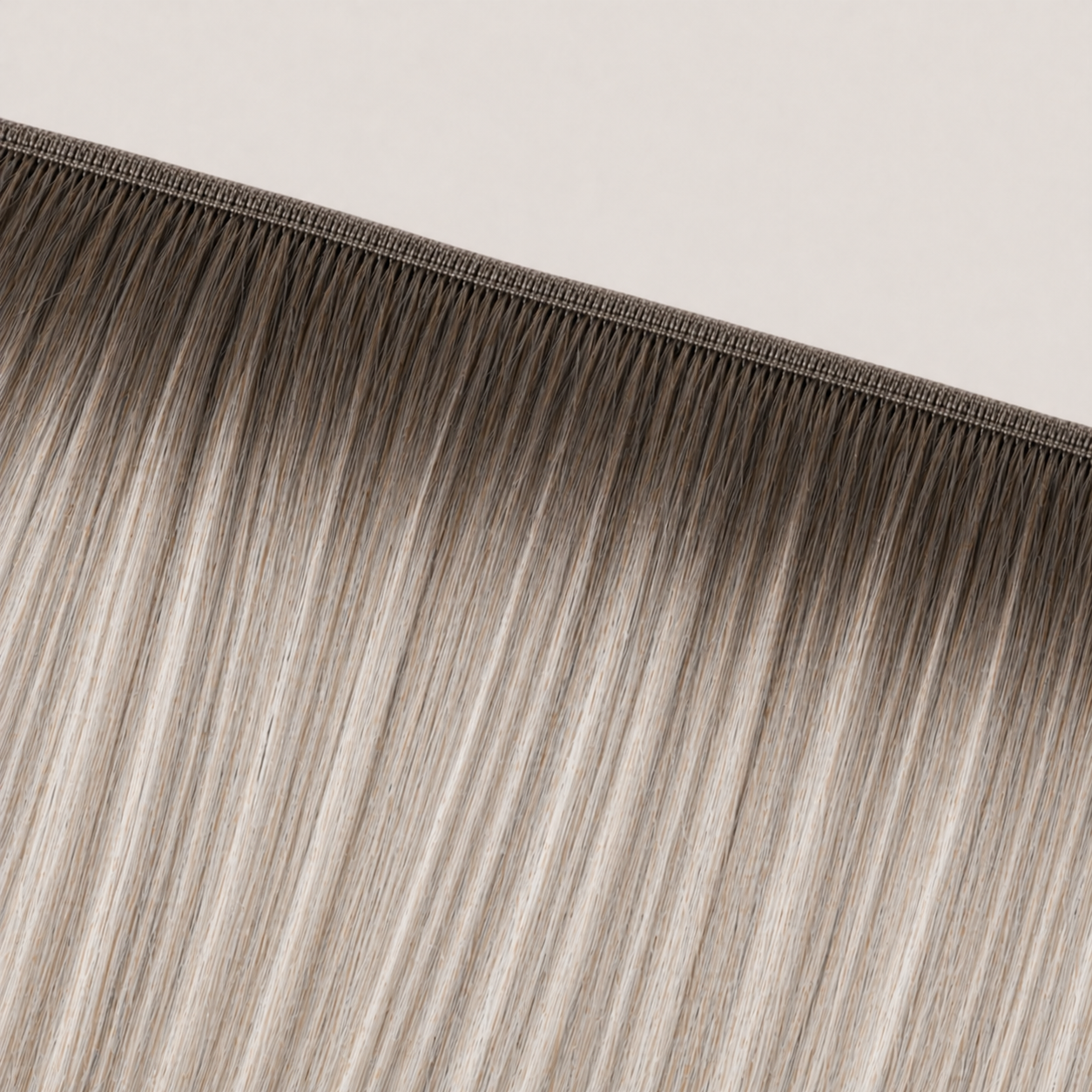 Flat butterfly weft seam of Stessia hair extensions in shade #7A/613/18A Balayage