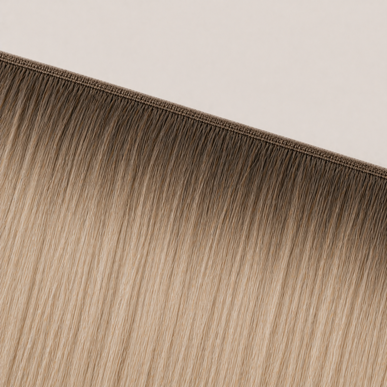 Flat butterfly weft seam of Stessia hair extensions in shade #8T60 Rooted
