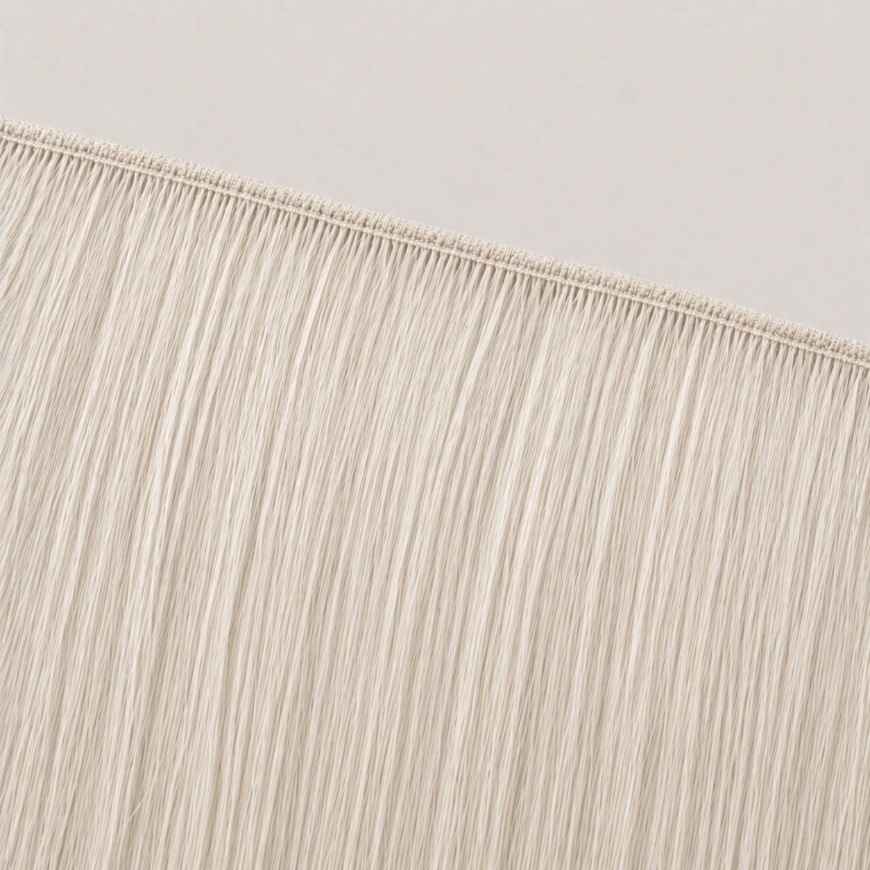 Flat butterfly weft seam of Stessia hair extensions in shade #Ivory
