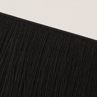 Flat butterfly weft seam of Stessia hair extensions in shade #1A Natural Black