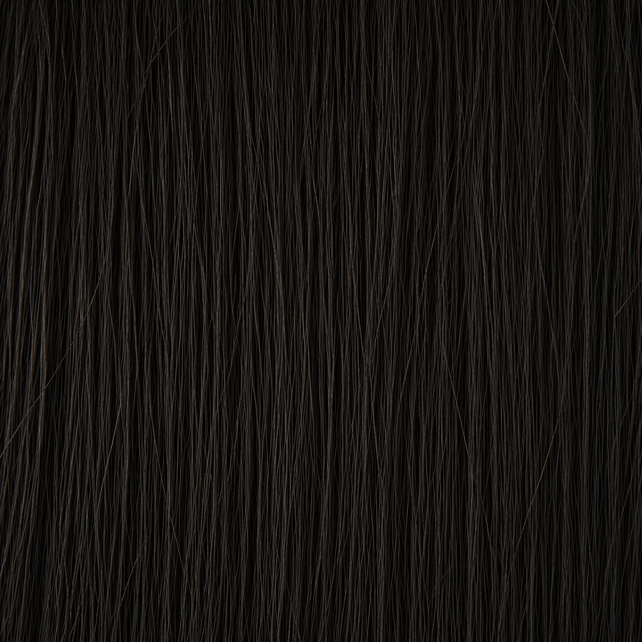 Close-up of the Remy human hair texture in shade #1A Natural Black