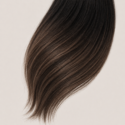 Stessia butterfly weft hair extensions in shade #1BT/2/4 Balayage, laid flat