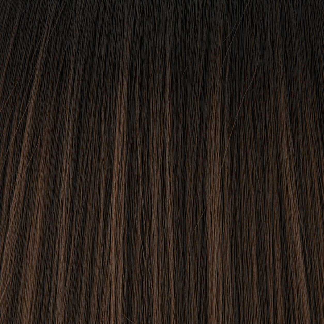 Close-up of the Remy human hair texture in shade #1BT/2/4 Balayage