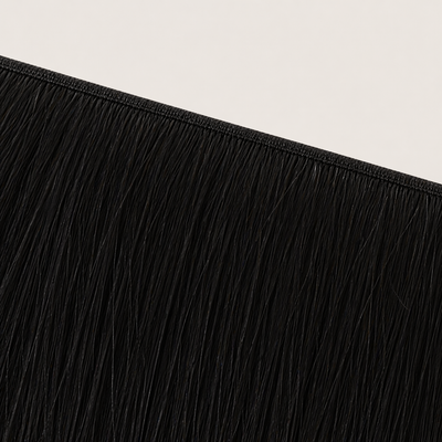 Flat butterfly weft seam of Stessia hair extensions in shade #1 Jet Black