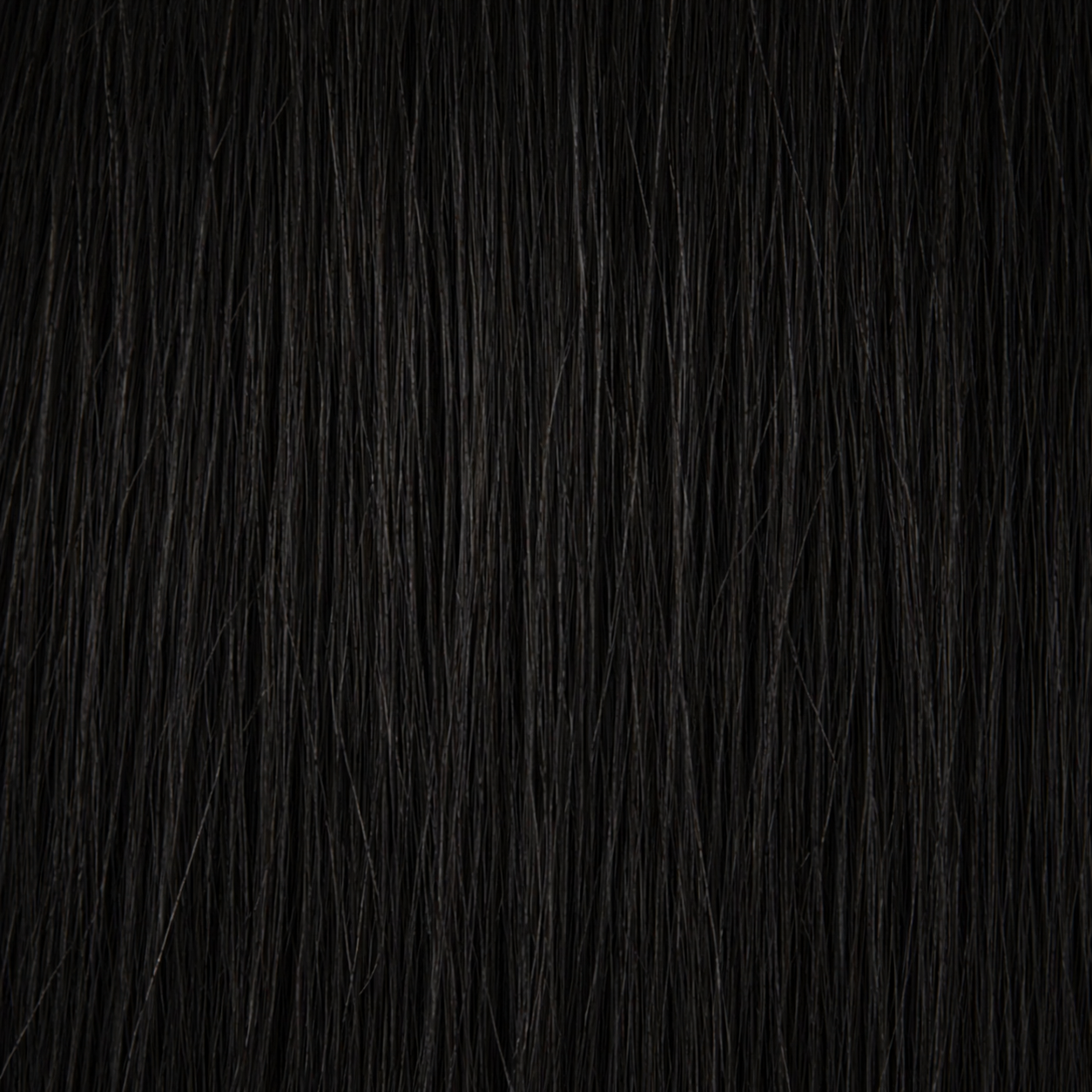 Close-up of the Remy human hair texture in shade #1 Jet Black
