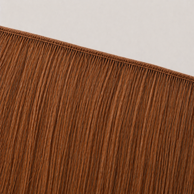 Flat butterfly weft seam of Stessia hair extensions in shade #30 Warm Copper