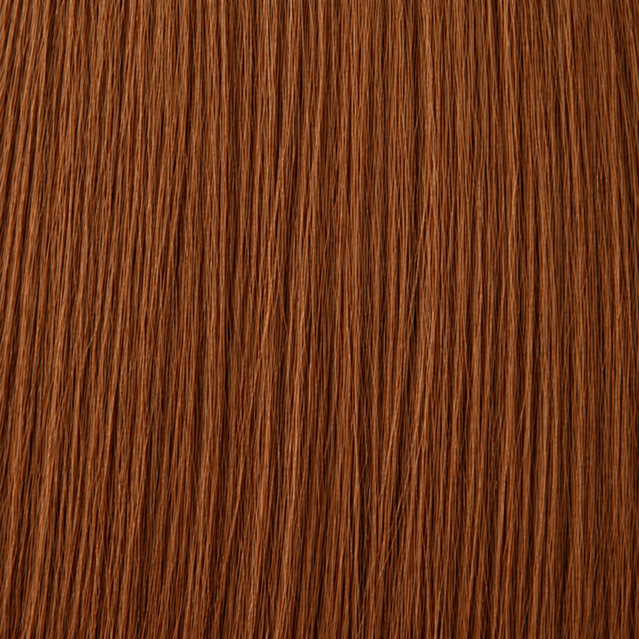 Close-up of the Remy human hair texture in shade #30 Warm Copper
