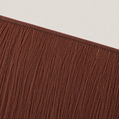 Flat butterfly weft seam of Stessia hair extensions in shade #33 Auburn