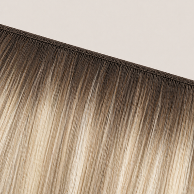 Flat butterfly weft seam of Stessia hair extensions in shade #5A/613/18 Balayage