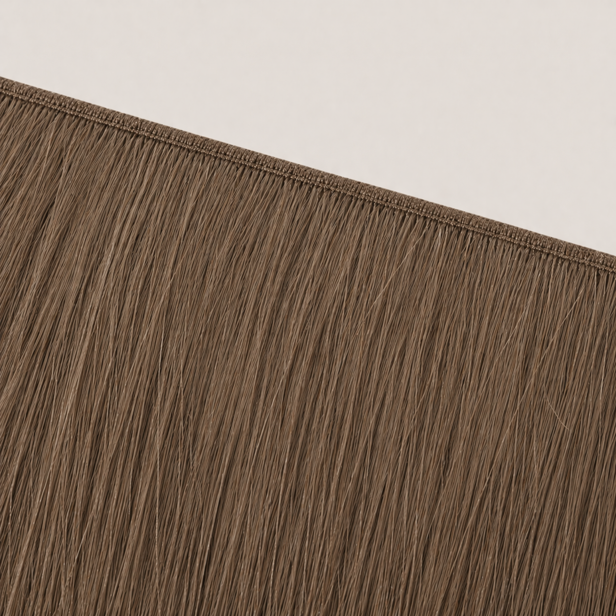 Flat butterfly weft seam of Stessia hair extensions in shade #5 Light Brown