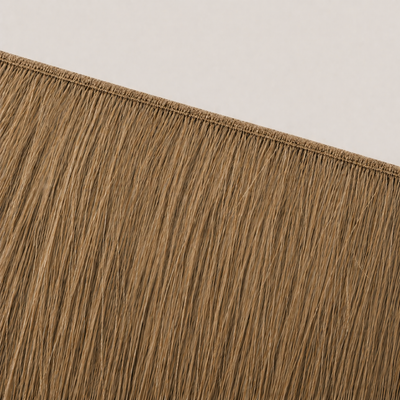 Flat butterfly weft seam of Stessia hair extensions in shade #6 Dark Blonde