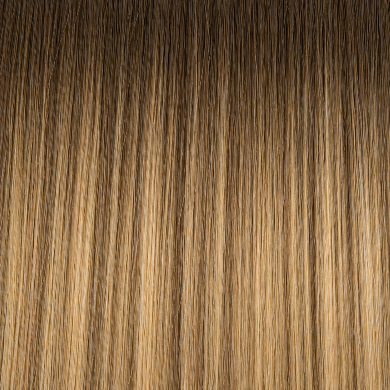 Close-up of the Remy human hair texture in shade #6/6T24 Balayage