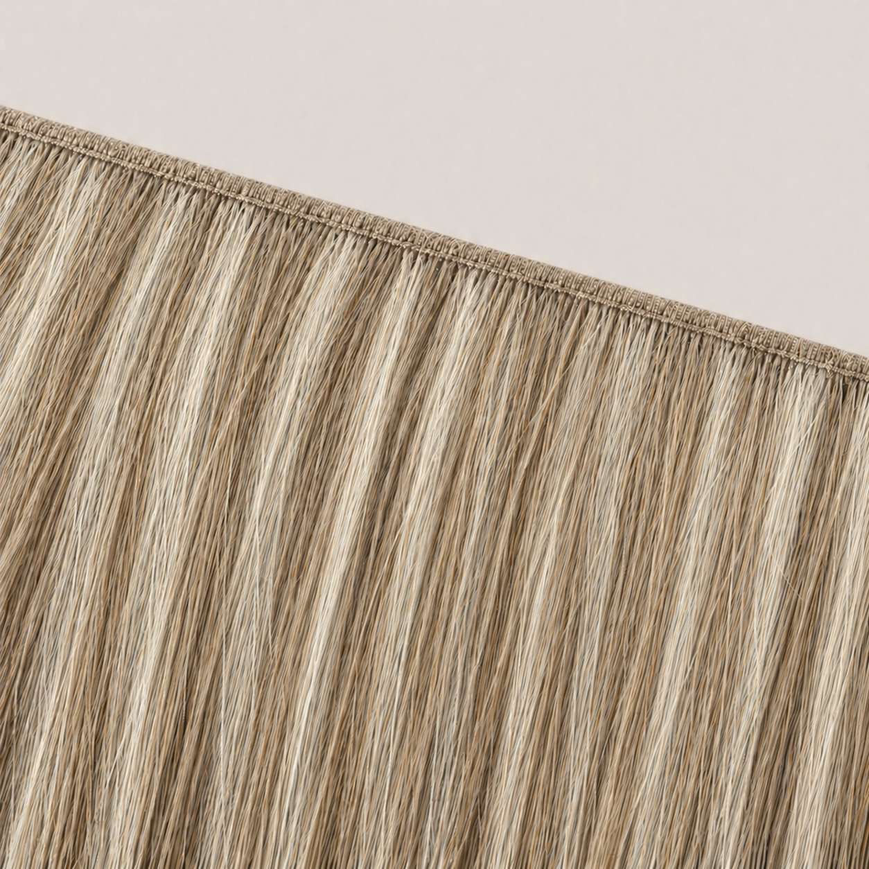 Flat butterfly weft seam of Stessia hair extensions in shade #8/613 Highlights
