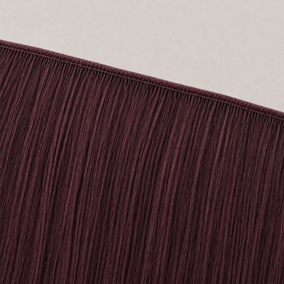 Flat butterfly weft seam of Stessia hair extensions in shade #99J Burgundy